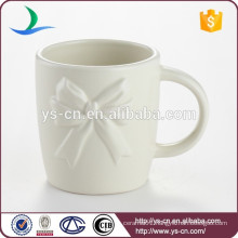 Vara Bow ceramic embossed mug for sale